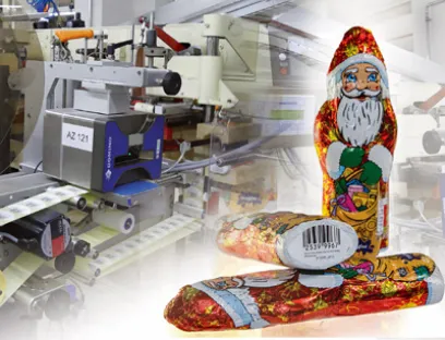 Die Thermotransferdrucker kennzeichnen Etiketten mit MHD sowie Chargencode, die am Boden der Schokoladenhohlkörper angebracht werden, Bild: Domino Deutschland Schokoladennikoläuse von Brandt, gekennzeichnet von Domino Deutschland
